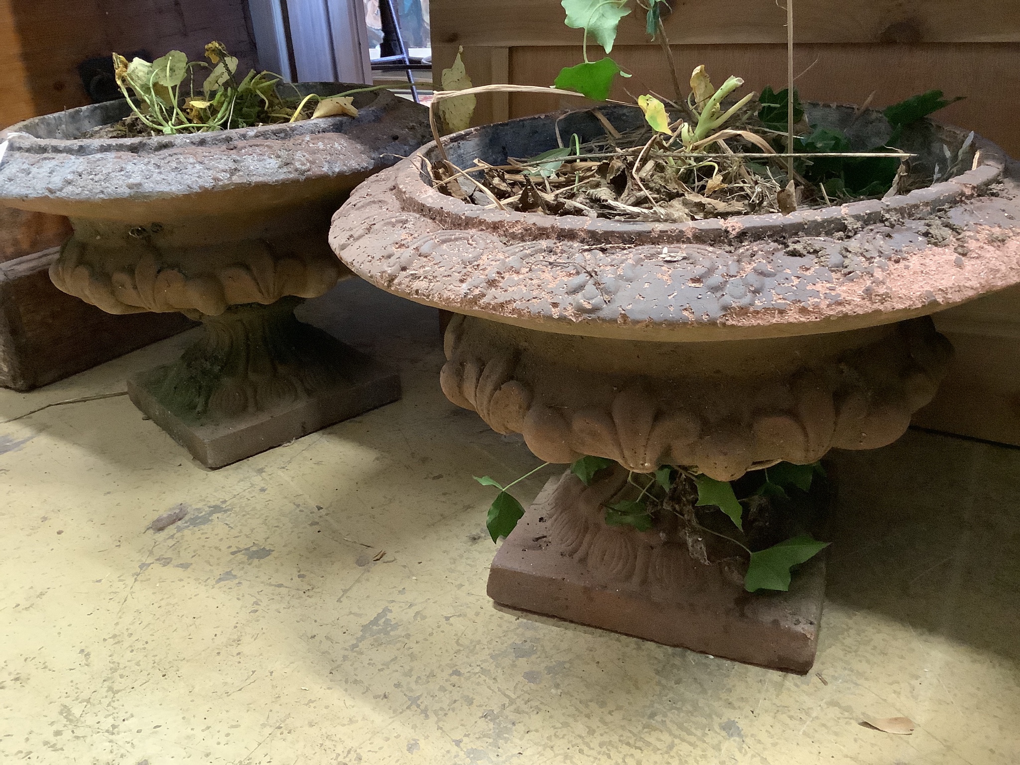 A pair of terracotta campana garden urns, diameter 44cm, height 30cm